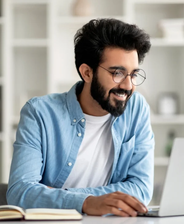 Two people grooming a dog